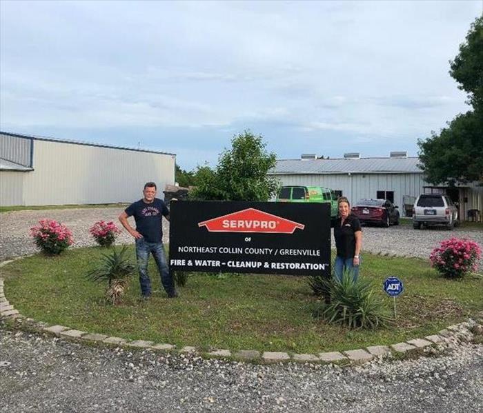 Owners in front of the new facility